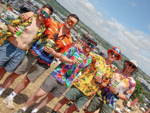 Five men in colourful shirts and sunglasses posing with Brothers Festival Apple at Glastonbury