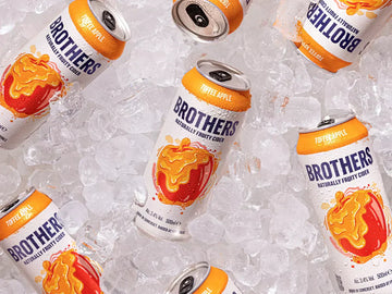 Cans of Toffee Apple chilled on ice