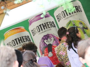 Large cans on banners promotion at Glastonbury Festival